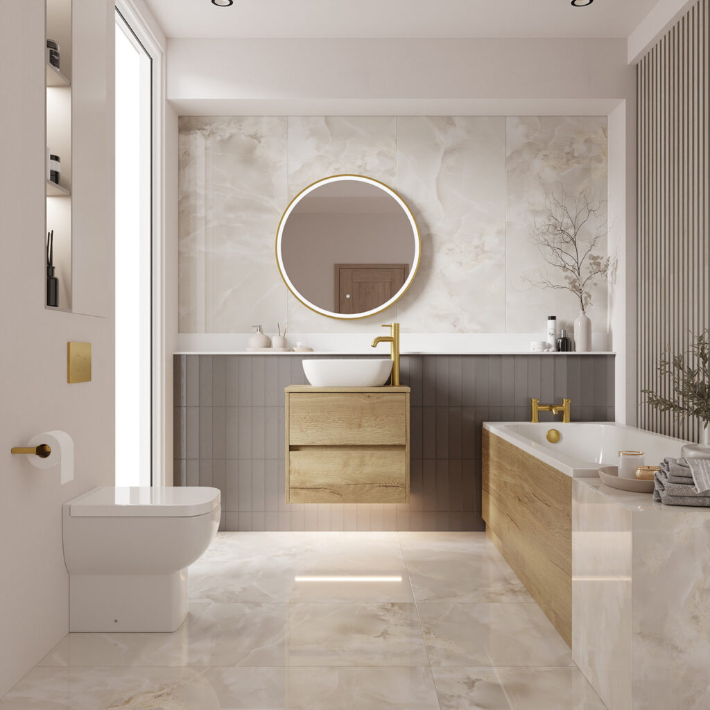 Modern bathroom with marble floors, wooden accents, and a round mirror, finished off with brushed brass taps and fittings