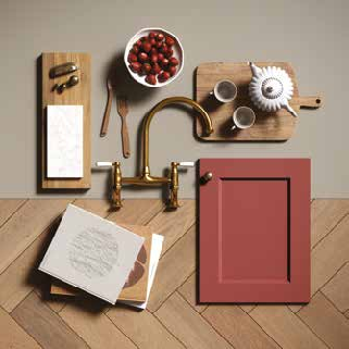Rich berry tones, warm wood textures, and brass accents create a kitchen full of elegance and character.